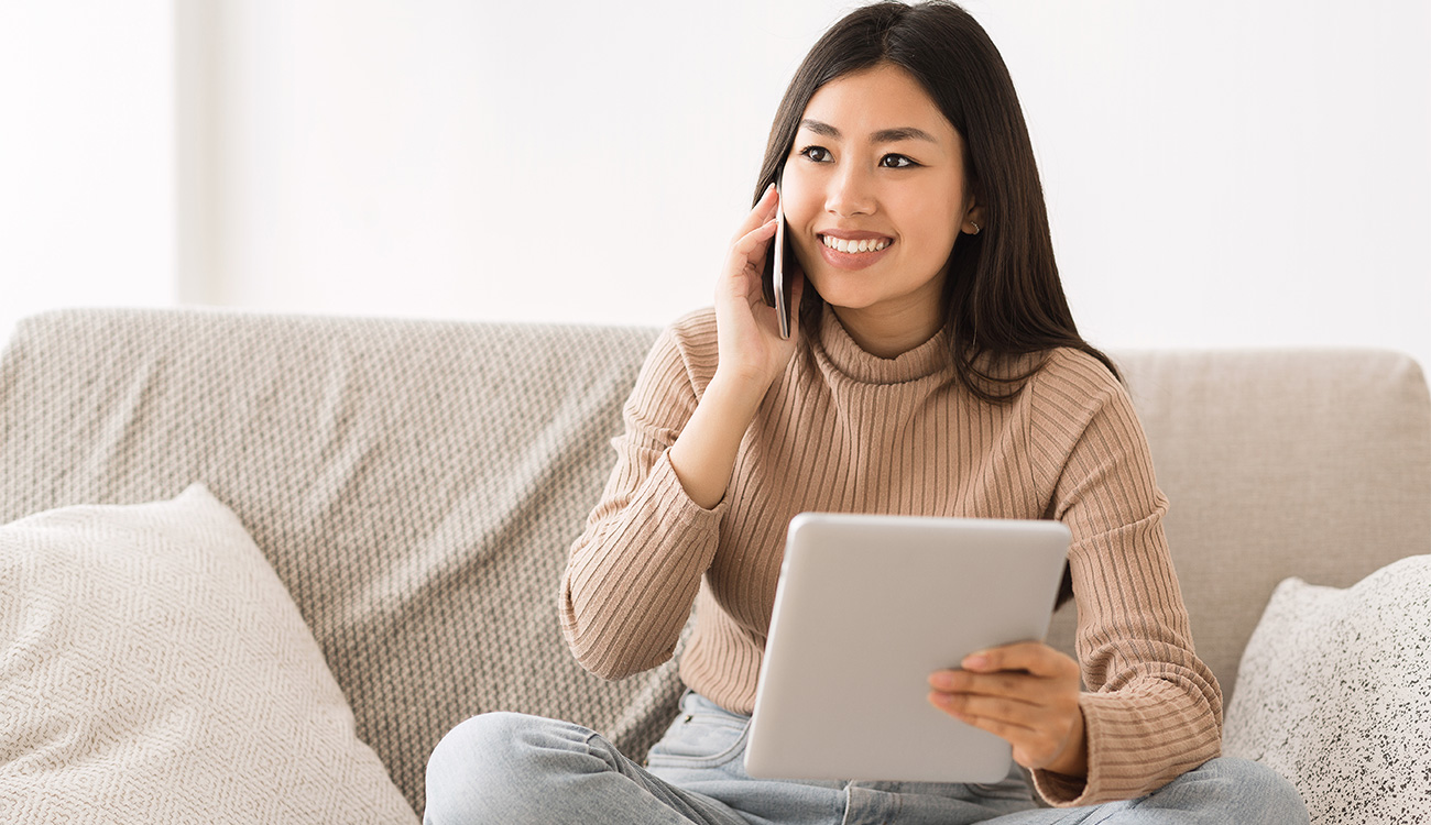 Asian woman talking on the phone