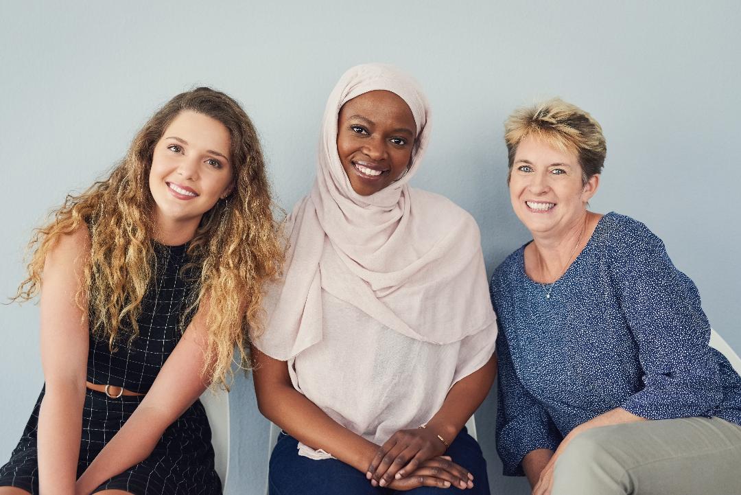 Three child care home providers smiling